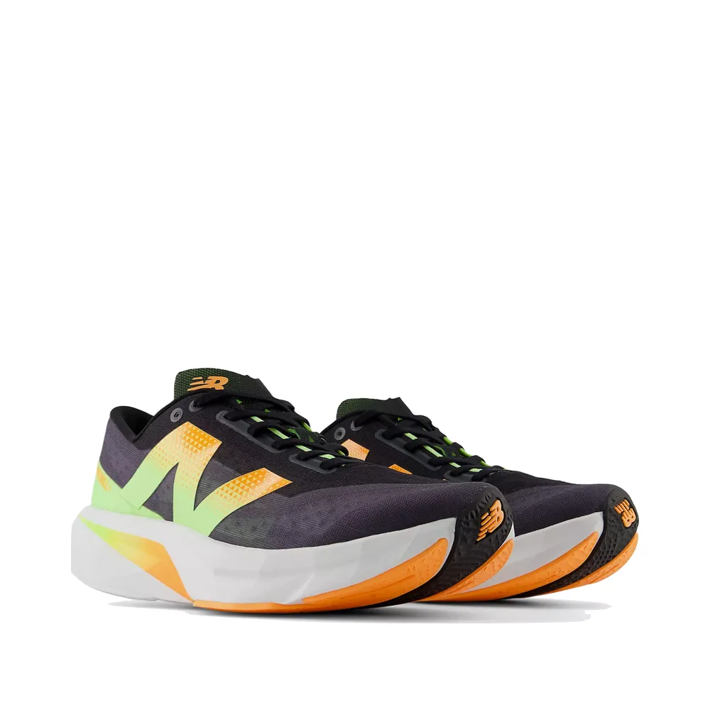 New Balance Men's FuelCell Rebel v4 Sneaker in Black with Graphite and White Peach